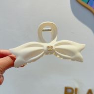 Chanel Bow Shark Hair Clip with Pearl Logo in PVC Beige