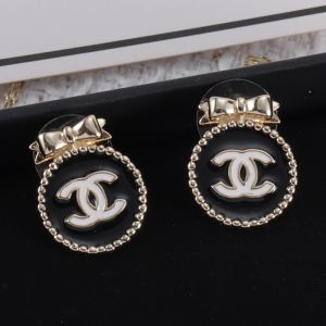 Chanel Bow Stud Earrings with Enamel Logo in Metal Gold