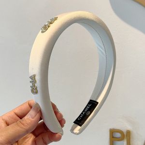 Chanel Headband with Crystal CHA Signature in Satin Beige