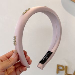 Chanel Headband with Crystal CHA Signature in Satin Pink